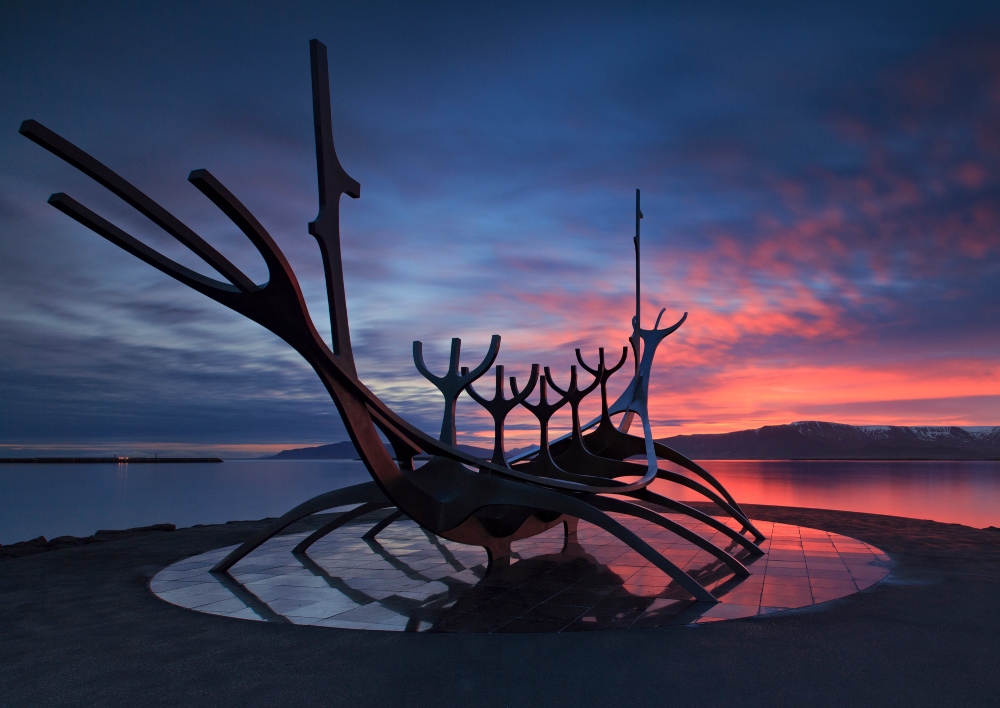 The Sun Voyager in Reykjavík at sunset, creating a brilliant silhouette .