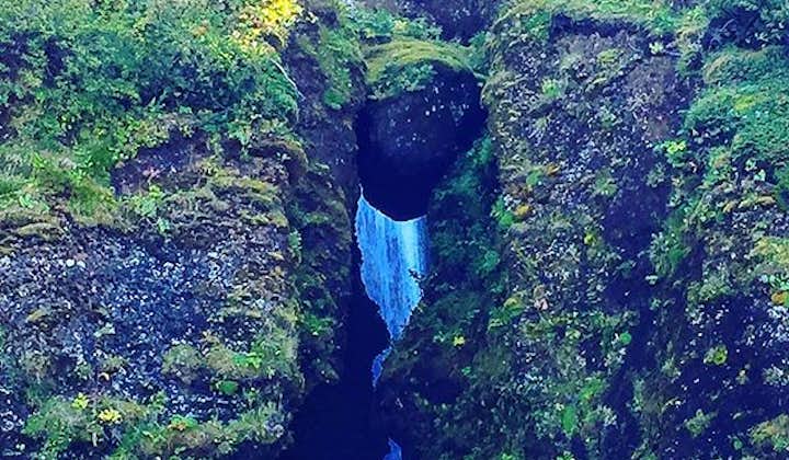 Gljúfrarbúi waterfall, near the more famous Seljalandsfoss waterfall, hidden in it's deep alcove.