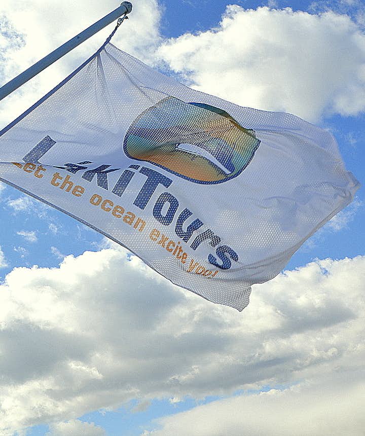 The flag of Láki tours whale watching
