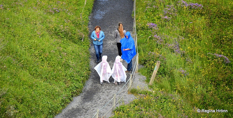 People on the path leading to Gullfoss waterfall