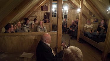 A traditional evening of tales and chatting at an Icelandic traditional Baðstofa room in the Wilderness centre, East Iceland.