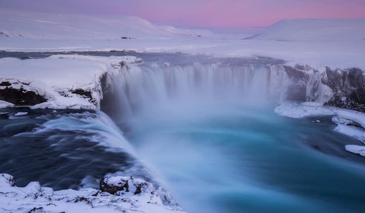 The stunning Godafoss waterfall blanketed with snow.