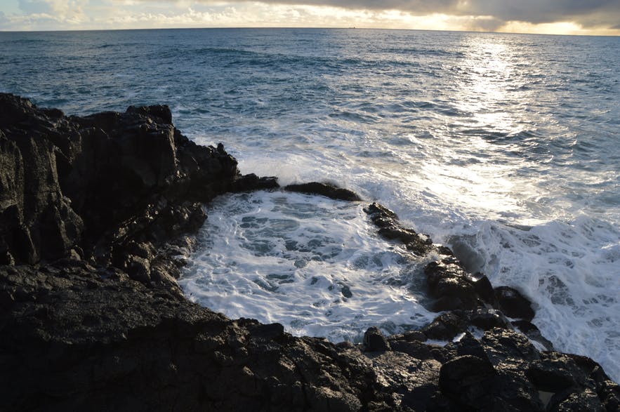 Brimketill on the Reykjanes Peninsula, as pictured under a sunset.