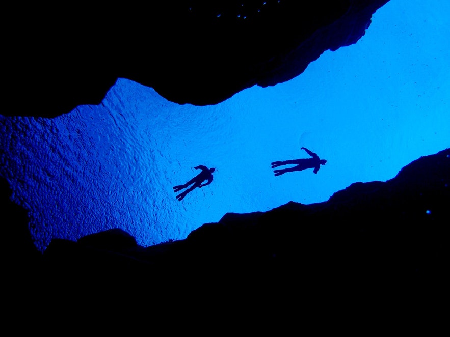Snorkel between two continents in Silfra fissure.