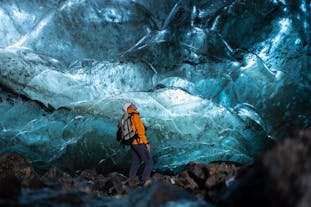 A tour joiner admiring the beautiful ice cave of Greenland.