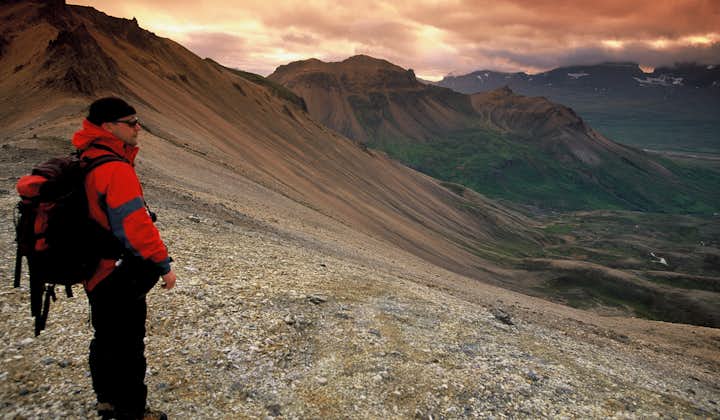 The high, red tinted mountains of East Iceland are where you will search for the sheep.