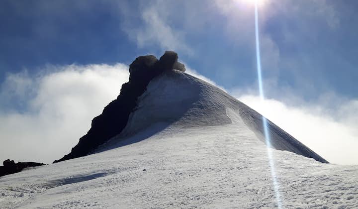 The peak of Snæfellsjökull glacier in the clouds.