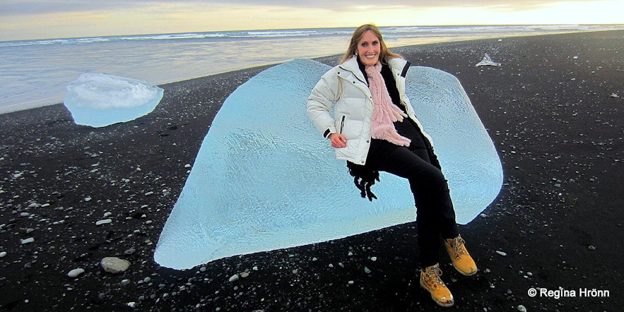 Regína chilling on an iceberg at the ice diamond beach Breiðamekrursandur