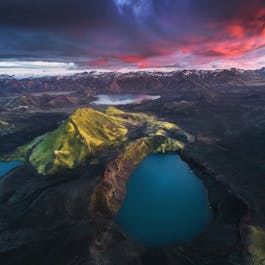 A highland crater lake under the midnight sun.