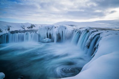 The stunning Goðafoss waterfall blanketed in snow.