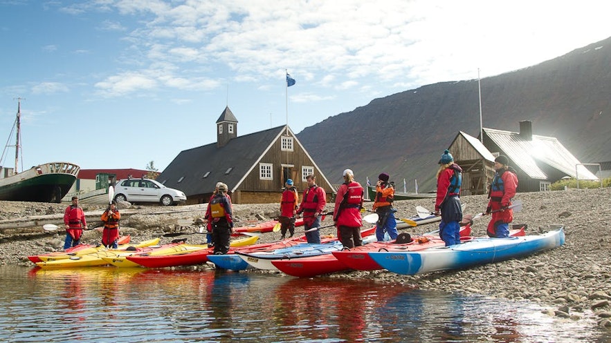 Kayakers prepare to embark on an adventure in Iceland.