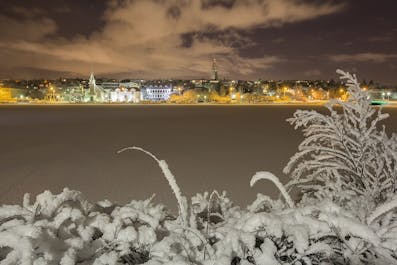 Reykjavik during winter, seen from across the bank of the river.
