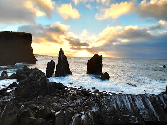 A dramatic rocky coastline on the Reykjanes Peninsula on a cloudy day.