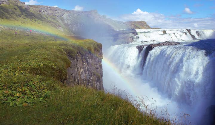 A rainbow shines in front of the powerful Gullfoss waterfall producing the perfect photo opportunity.