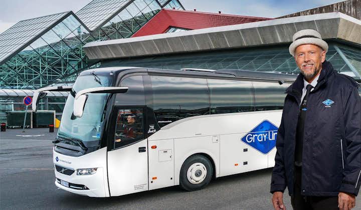 Our professional driver poses with one of our buses behind him.