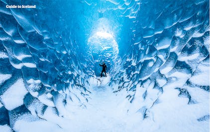 A person standing in an ice cave within a glacier in Iceland.