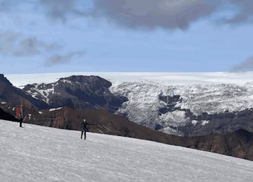 Hikers traversing the icy terrain of Oraefajokull.