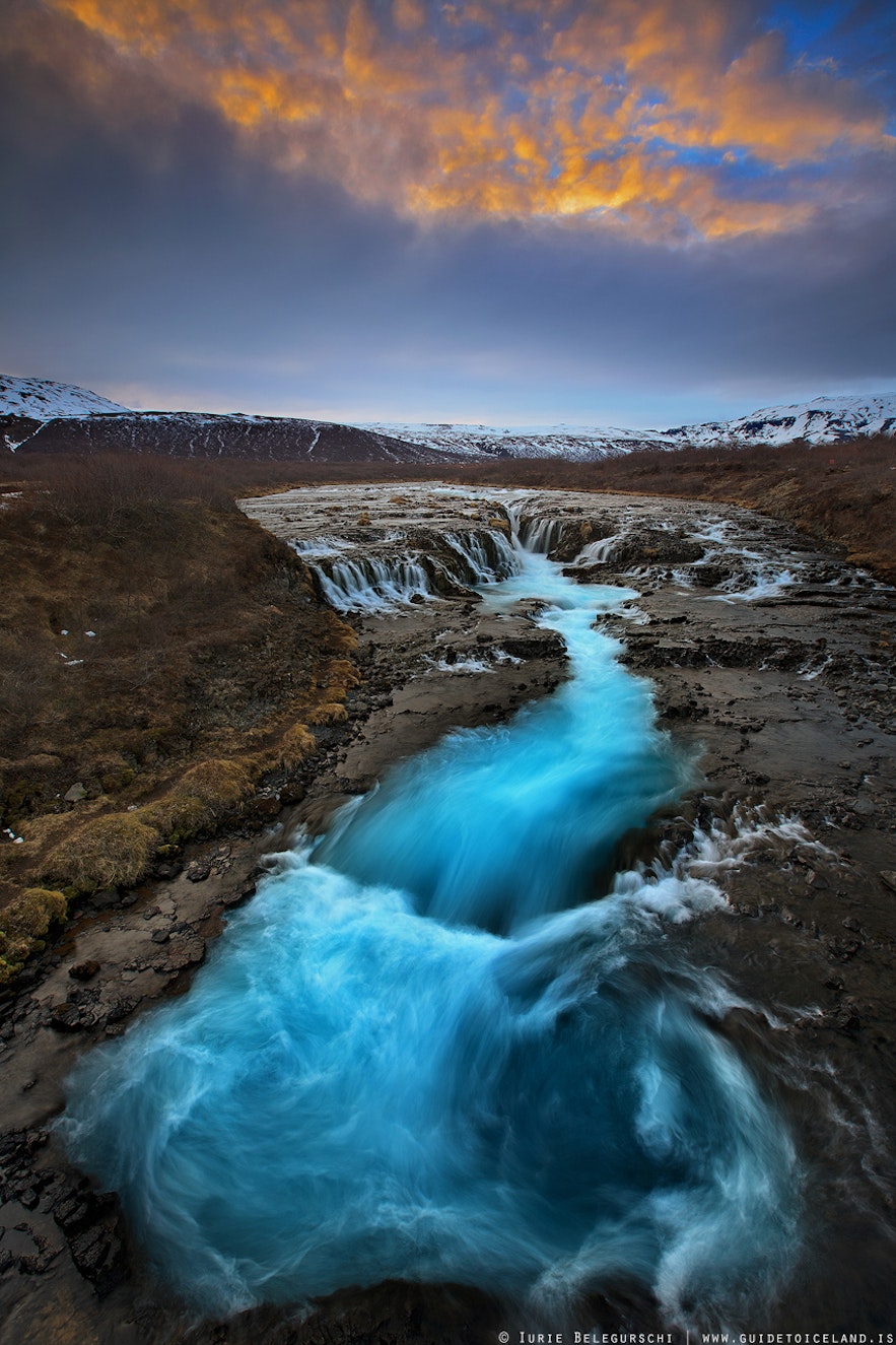 Bruarfoss waterfall flowing with bright blue water