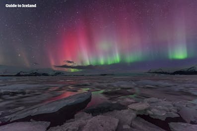 Jökulsárlón has doubled in size over a fifteen year, but is still no match for the sheer expansiveness of the Aurora above.