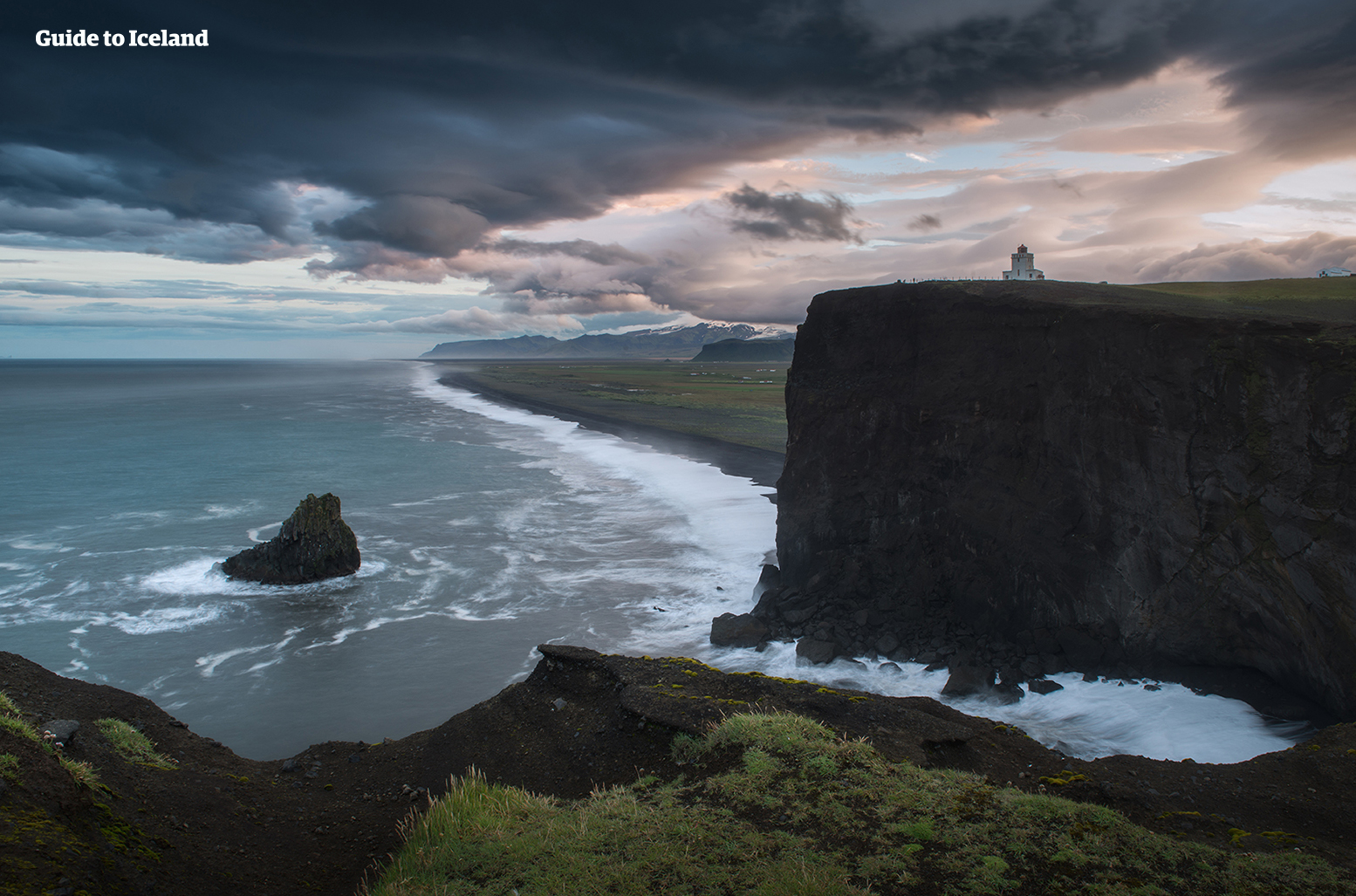 The black sands of Iceland's South Coast meet the Midnight Sun.