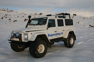Experience the magic of snow-covered vistas from the comfort of a Superjeep.