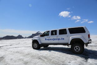A super jeep parked on the snow during a tour of Iceland's Golden Circle in winter.