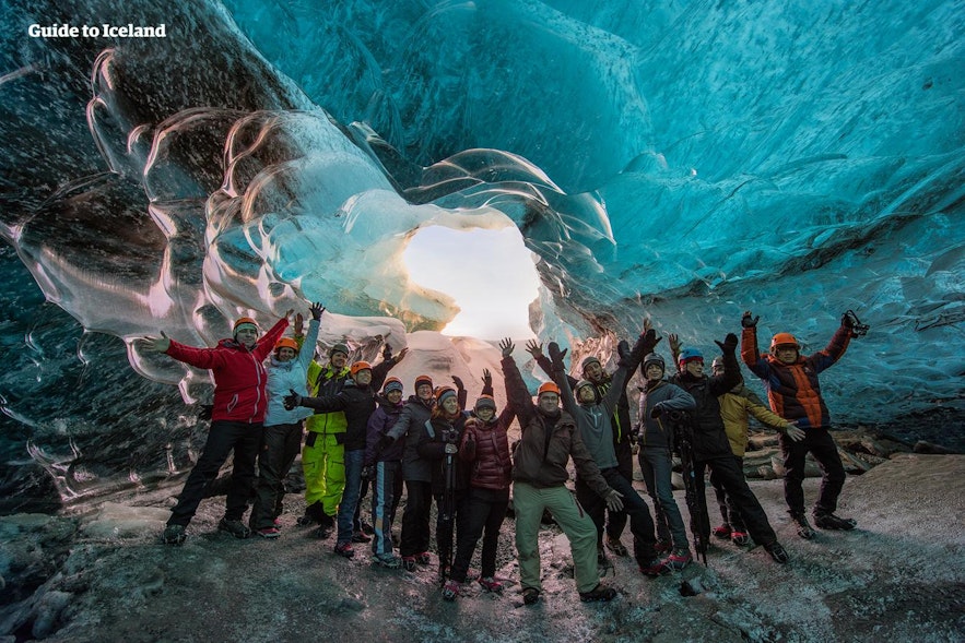 A happy tour group in an ice cave