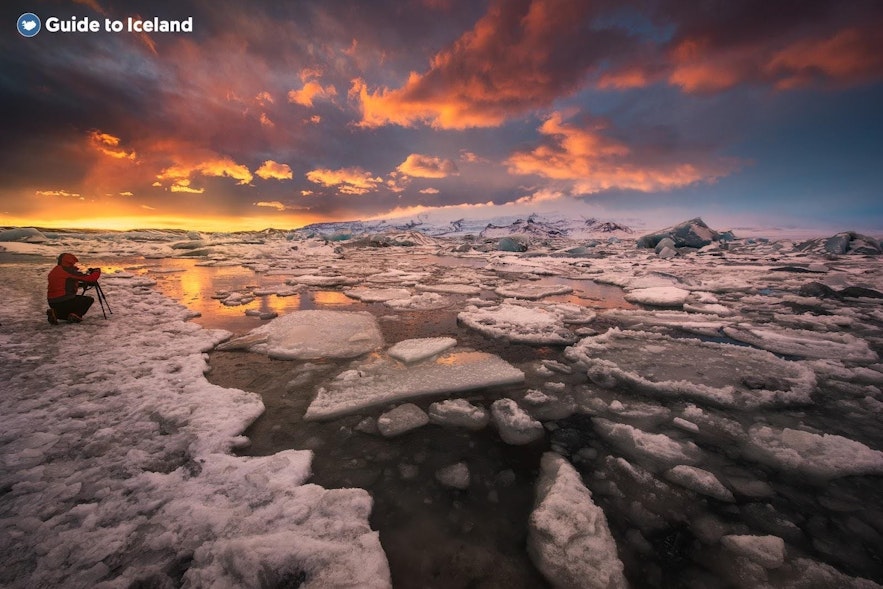A photographer shoots Jokulsarlon glacier lagoon