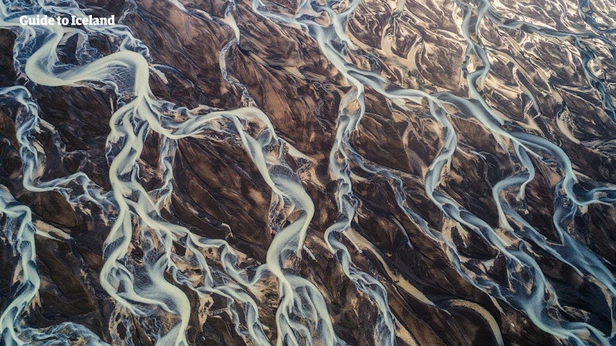 Rivers moving across a stretch of sand