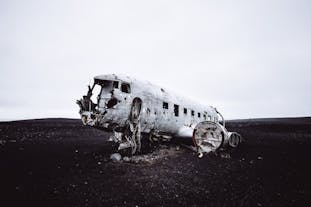 The DC-3 plane wreck in Solheimasandur is an excellent location for photography of the contrasting aircraft ruins against the beach’s black sand.