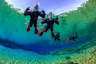 Two people snorkelling in Silfra