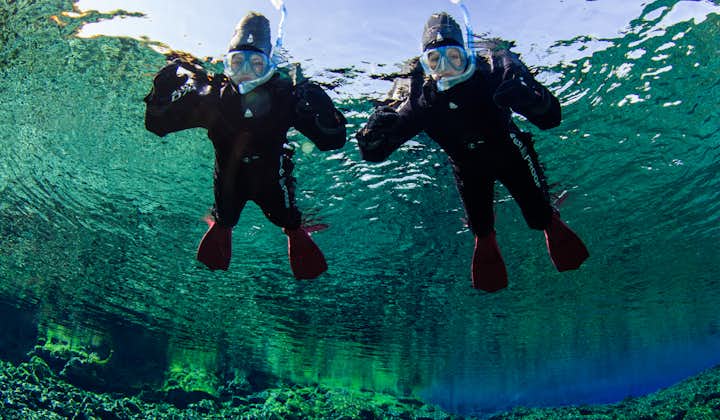 Two people snorkelling in Iceland