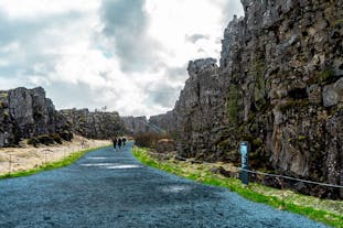 A walking path leads through the majestic landscapes of Thingvellir National Park.