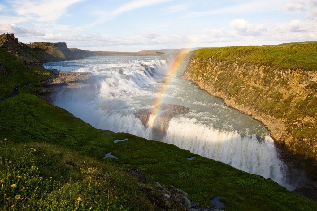 A rainbow arches from Gullfoss waterfall.