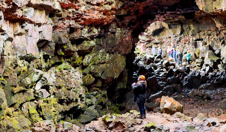 The colorful rock formations inside the Raufarholshellir lava cave are a sight to behold.