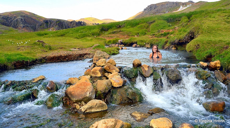 Reykjadalur valley geothermal area - Regína soaking in the hot river