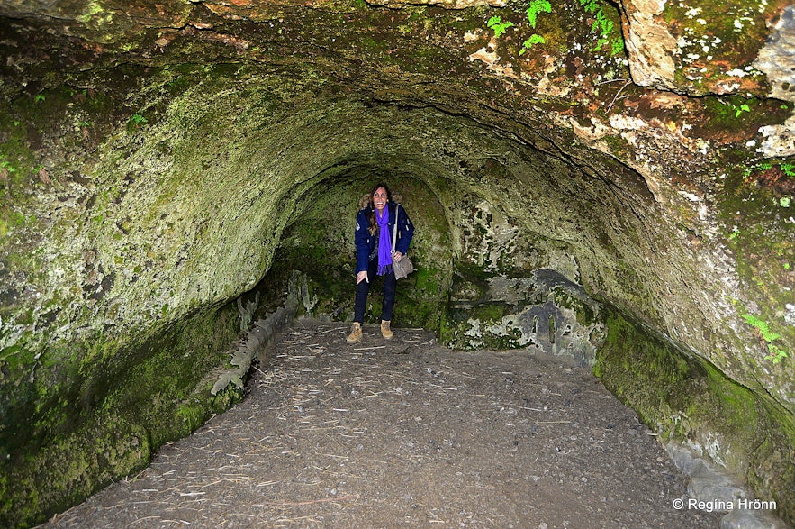Regína inside Baðstofuhellir - the Cave of the Pastor of Fire