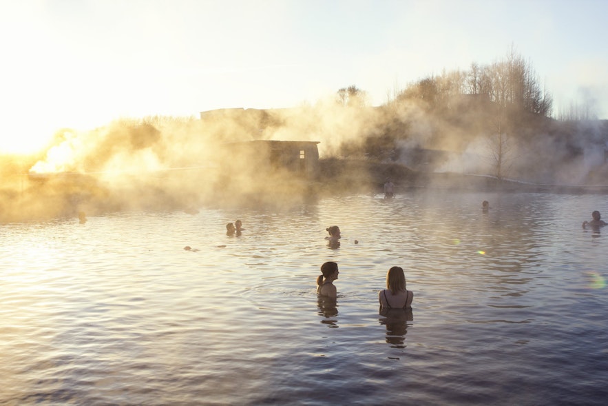 Bathers relax in the Secret Lagoon, Iceland's oldest outdoor pool.