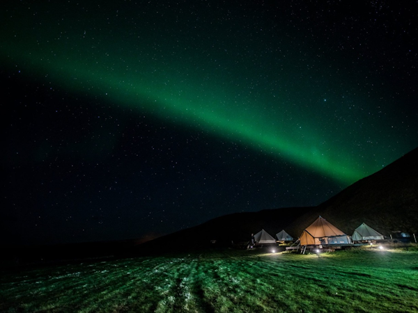 Auroras dance over the Farmhouse Lodge in South Iceland.