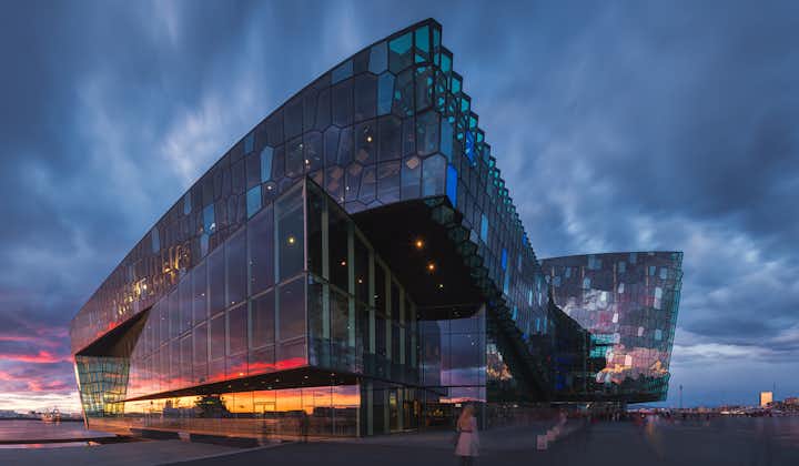 Harpa Concert Hall which sits on the shores of Reykjavik harbor, photographed at sunset.