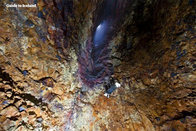 The multi-coloured layers of rock inside the Thrinukagigur Lava Tunnel in Iceland.