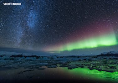 The green, pink and purple colours of the Northern Lights as they dance above Jökulsárlón glacier lagoon