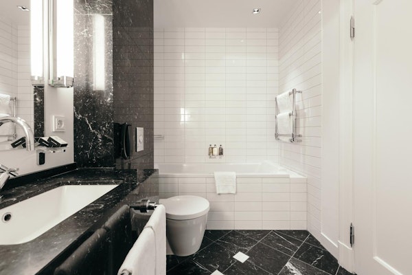 Many rooms at Hotel Borg by Keahotels have baths.