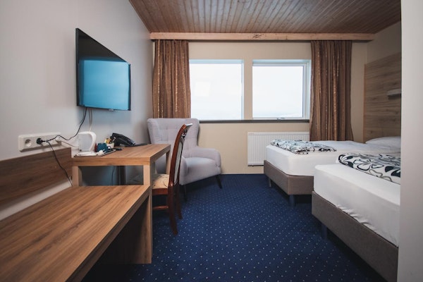 Hotel Dyrholaey's rooms have access to televisions.