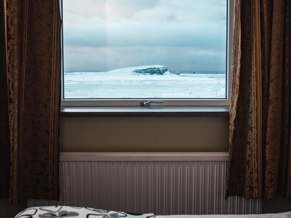 Hotel Dyrholaey's rooms have lovely views over winter landscapes.