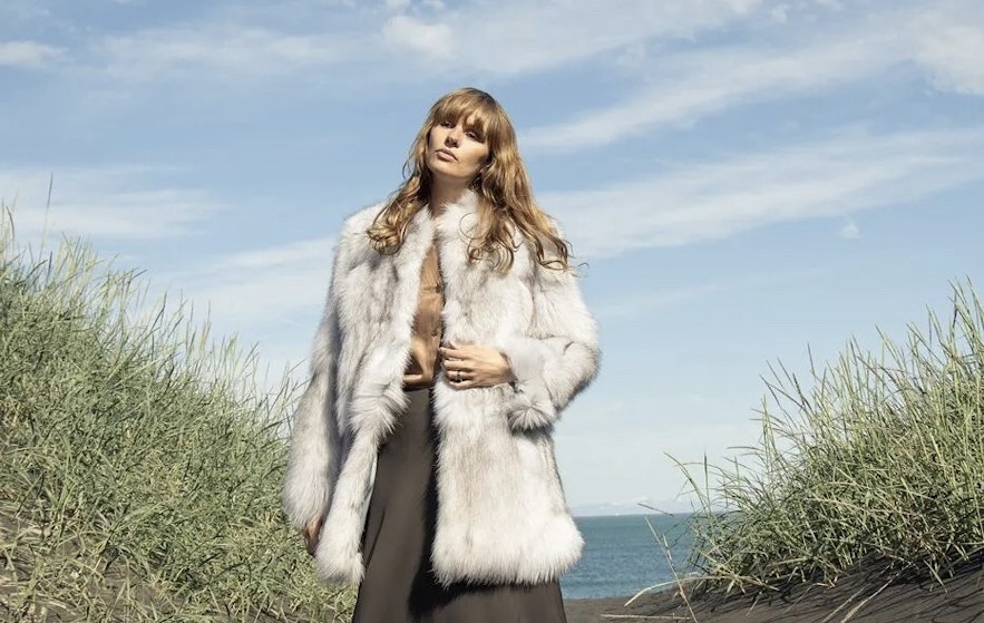 Girl wearing Icelandic fur design jacket outside