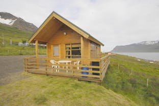 The outside of the Solbrekka Holiday Homes cottage at the edge of the Mjoifjordur fjord in East Iceland.