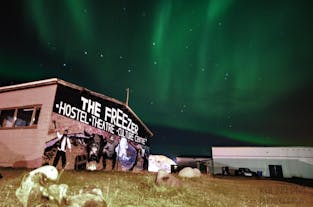 The Freezer Hostel, beneath the Northern Lights in Iceland.