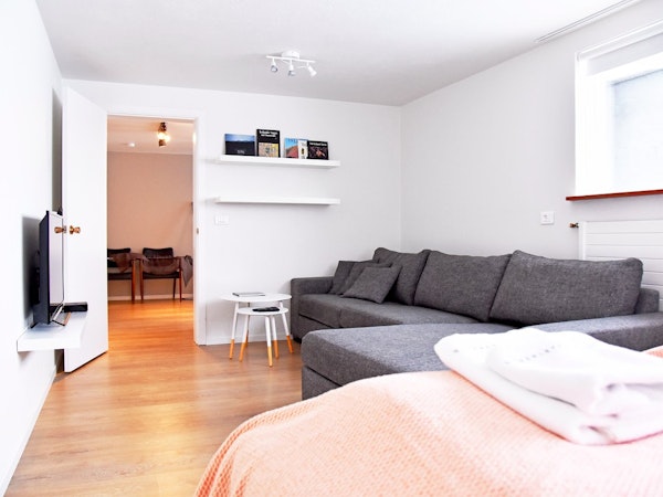The living area of the Natura Apartments is comfortable and spacious.