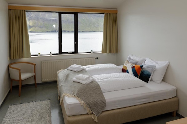 The comfortable twin rooms of the Cliff Hotel have beautiful views of the Eastfjords.